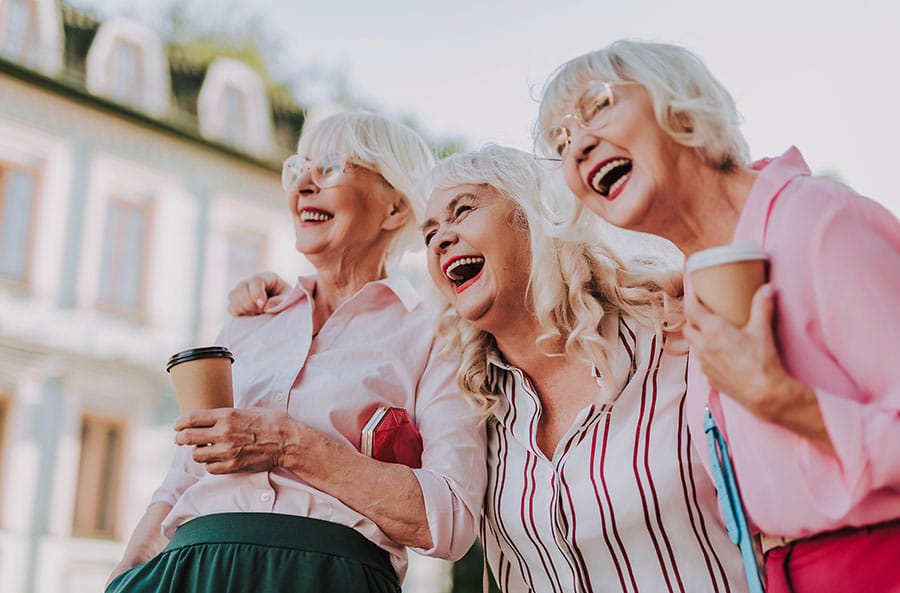 Three senior ladies enjoying their friendship.